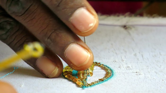 Women from Savda Ghewra working on a product
